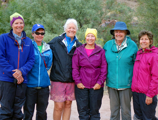 Guests wearing rain gear
