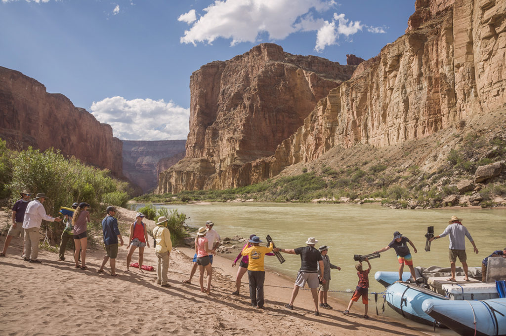 Guests helping unload the rafts