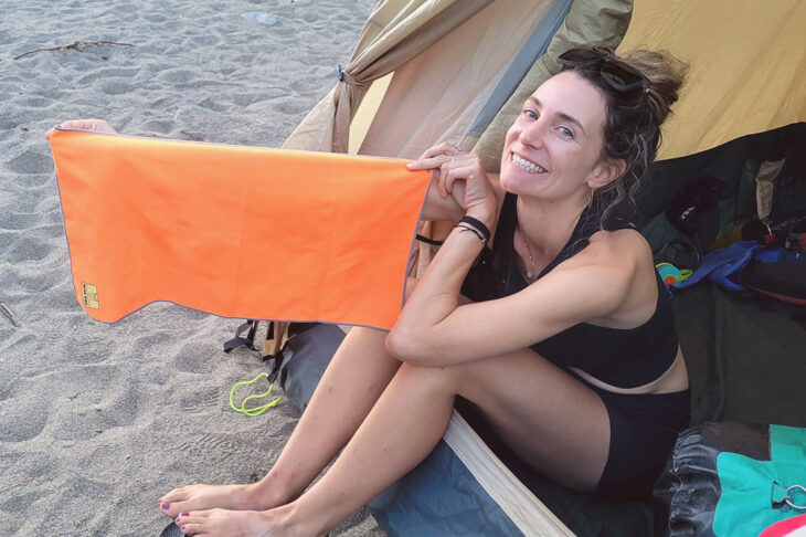 Woman holding a synthetic towel