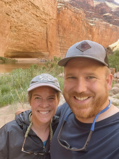 A married couple smiling at the camera. 