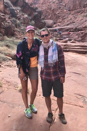 Two people with sarongs around their necks.