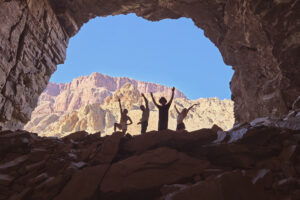 People silhouetted in a Grand Canyon cave.