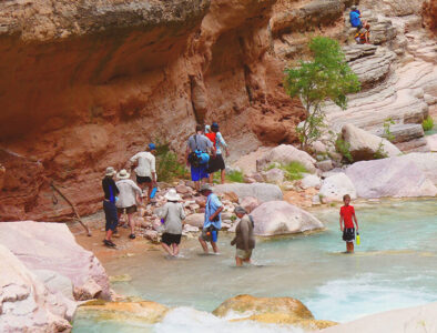 Guests crossing a creek