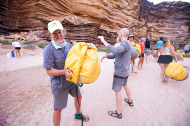 Loading a boat with dry bags