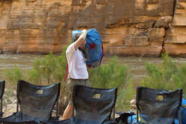 Guest carrying bag in camp