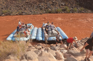 Guests getting off a motor raft