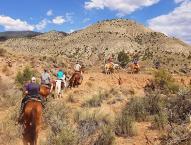 A leisurely horseback ride in the Arizona desert. Horseback riding at Bar 10