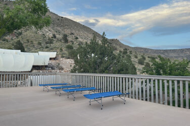 Cots on a deck at Bar 10 Ranch.
