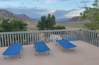 Cots on a deck at Bar 10 Ranch.