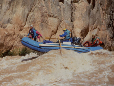 Oar boat going through a Grand Canyon rapid