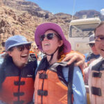 Group smiling on a jet boat