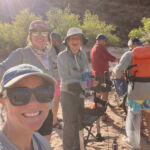 Group smiling in the Grand Canyon.