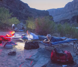 Two men at night on cots