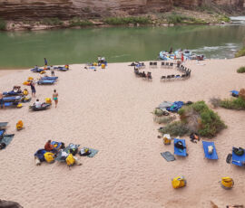Overview of a camp in the Grand Canyon with people spread out on cots