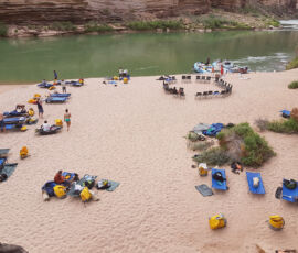 Overview of a camp in the Grand Canyon with people spread out on cots