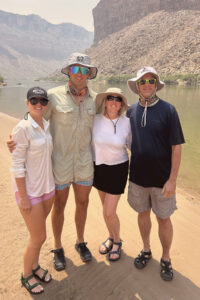 A family posing for a photo in the Grand Canyon.