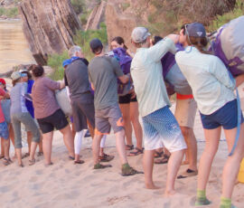 A "duffel shuffle," bringing dry bags up on the beach.