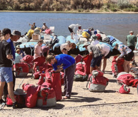 Guests arrange things in dry bags.